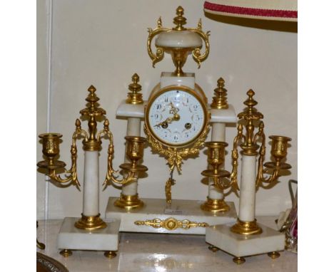 A portico striking mantel clock with garniture 