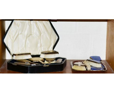 A cased Art Deco silver five piece dressing table set, Birmingham 1929, with engine turned decoration, together with a pair o
