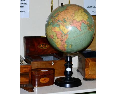 A 12 inch Terrestrial globe by W & A.K. Johnston Edinburgh, on ebonised stand together with a 19th century mahogany oval cadd