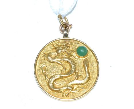 A Chinese 'Good Fortune' pendant, circular with the motif of a dragon chasing a jade cabochon and 'good fortune' verso, measu