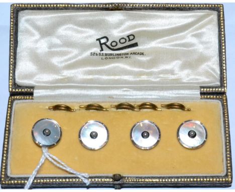 A cased set of four dress buttons, a seed pearl within a border of black enamel to mother-of-pearl plaques in rope frames, re