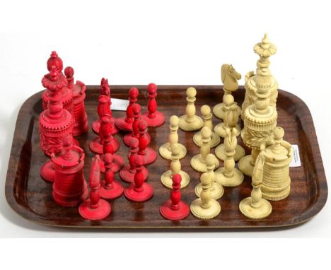 A carved and stained bone chess set, tallest piece 13cm 