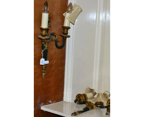A pair of parcel gilt green painted twin light wall sconces