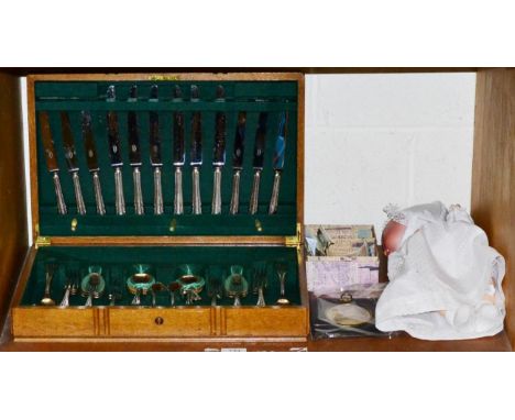 A canteen of plated cutlery, a group of foreign coins and banknotes, an Armand Marseille bisque head doll and a small 18th ce