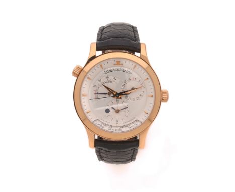 JAEGER LECOULTREMASTER GEOGRAPHIC. REF. 142.2.92.Montre bracelet en or jaune sur cuir avec second fuseau horaire (jour/nuit),