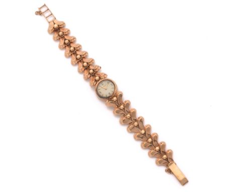 ANNEES 40Petite montre bracelet de dame en or rose 9k.BOITIER : rond avec remontoir au dos.CADRAN : argenté avec index flèche
