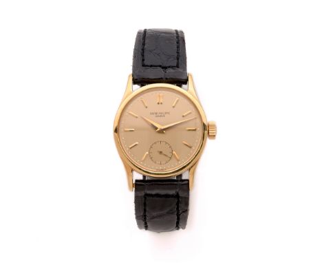 PATEK PHILIPPECALATRAVA. REF. 96.VENDUE LE 28 MAI 1957Montre bracelet en or jaune sur cuir.BOITIER : rond. Couronne ornée de 