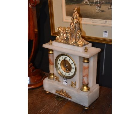 A French alabaster mantel clock, circa 1900, with classical gilt metal frame with lions to the top, above onyx style half col