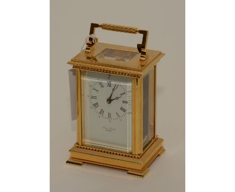 A brass carriage clock by Jessop Jewellers Glenrothes, with eleven jewel movement, in fitted box with key, 18cm high