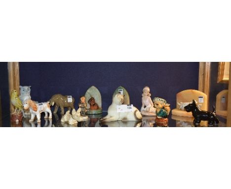 A small collection of ceramic animal and child figures, to include Sylvac Scottie dog, Beswick Siamese cat, Beswick novelty c