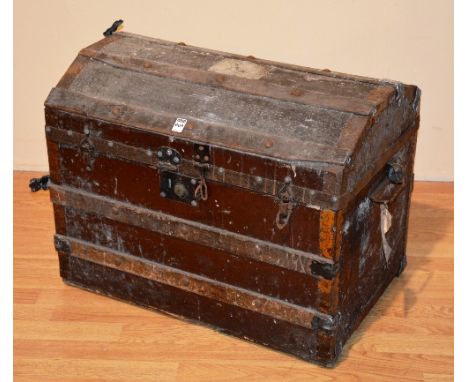 A vintage wood bound travel trunk, the hinged top enclosing fitted interior, with metal carry handles, 53cm high x 69cm wide