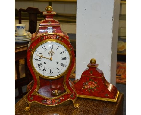 A reproduction French style balloon shaped bracket clock, the white enamel dial with Roman and Arabic numerals, with wall mou