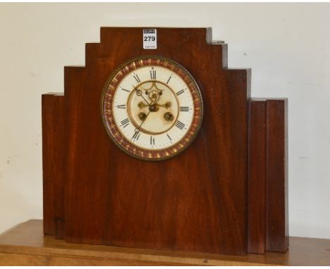 An Art Deco mahogany cased mantel clock, the white enamel dial with Roman numerals, and striking bell movement, 37cm high