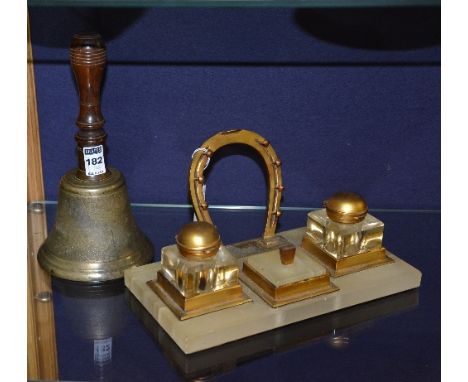 A vintage brass school bell, with turned wood handle, 25cm high, also with deskstand with horseshoe pen rack (2)