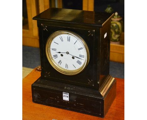 A Victorian black slate mantel clock stamped J. Hutchinson & Sons Paris, the white enamel dial with Roman numerals, stamped 1