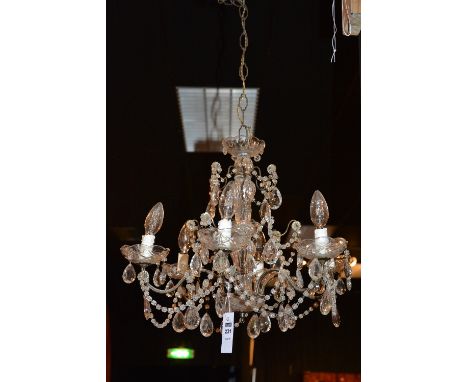 A cut glass ceiling light, decorated with pear shaped drops and pans, 37cm high