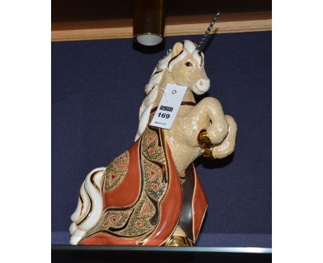 A De Rosa limited edition ceramic unicorn, 339/1000, palomino in colour with rust and gold coloured rug, horn has been replac