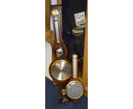 A Georgian style reproduction mahogany wall barometer, with silvered thermometer gauge and dial, 93.5cm high, also with small