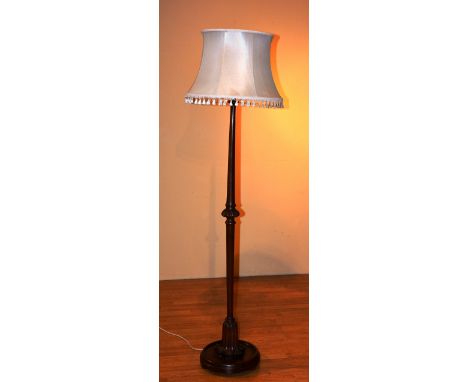 A mahogany floor lamp with shade, 187cm high