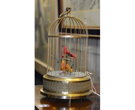 A 20th century German singing birdcage automaton, in the Victorian style, with two songbirds, one upon perch, within wirework
