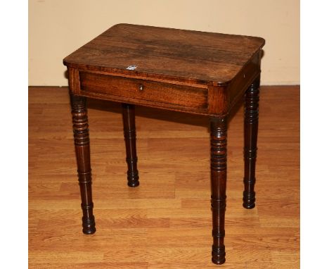 An early Victorian rosewood work table, with drawer and small drawer to each side, raised on ring turned supports, 63cm high 