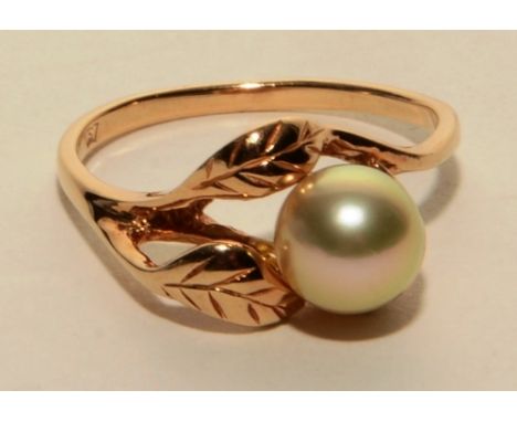 A 10ct gold pearl ring, the central white pearl within leaf motif setting, stamped 10k to underside, ring size Q