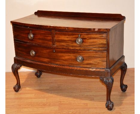 A Chippendale style mahogany bow front bedroom chest of drawers, with two small drawers above long drawer, raised on cabriole