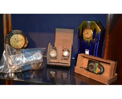 A small quantity of watches and clocks, to include Storm and Sekonda, a 1920's Swiss clock, a Rolex watch stand, a compass by