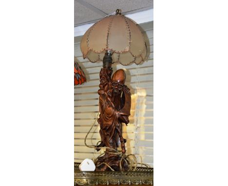 An early 20th century Chinese rootwood carved table lamp of Sage Shao Lao, with original shade, 37cm high