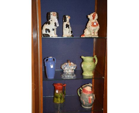 A small collection of ceramics, to include wally dugs, green relief hunting jug, Toby jug, blue Royal Doulton vase and stonew