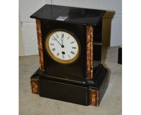 A Victorian black slate and marble mantel clock, the white enamel dial with Roman numerals, flanked by mottled marble columns