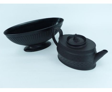 A Neoclassical black basalt teapot of oval form, 15 x 29 x 16cm, together with a Wedgwood black glazed jardiniere of oval for