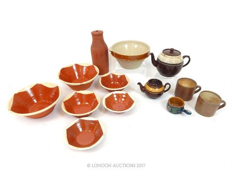 An assortment of rustic English and French ceramic wares to include hand-thrown and glazed bowls, a terracotta wine cooler,  