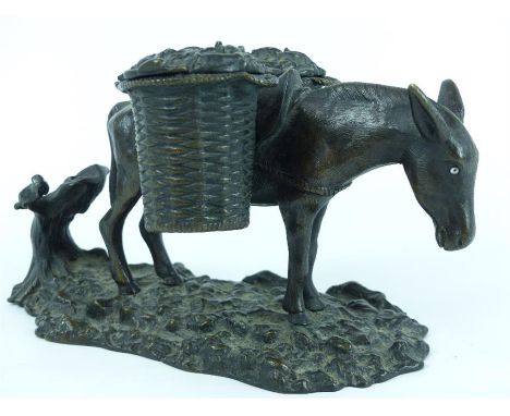 A 20th century bronzed metal inkwell and pen holder in the form of a donkey carrying laden baskets, (without glass liners) st