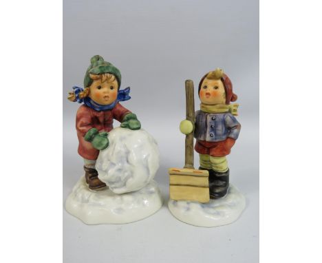 Two Goebel Hummel Figurines "First Snow" Tmk 7 with box  and "Let it snow" Tmk 7. The tallest is approx 15cm tall.