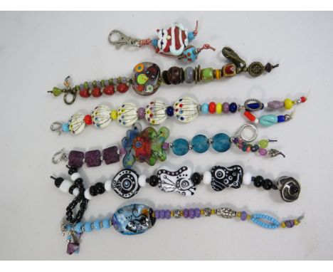5 Artisan handmade lampwork glass bracelets plus a key ring.