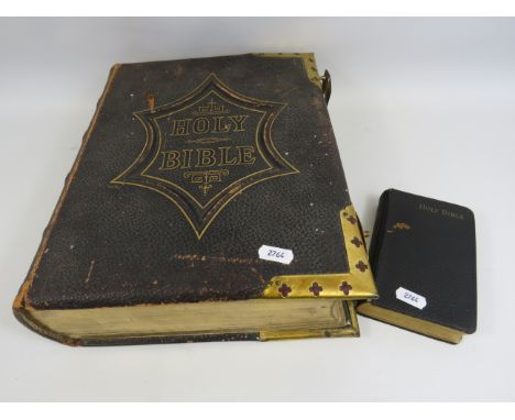 Large leather and brass bound vintage family bible plus one small one.