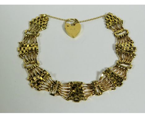 9ct Yellow gold Gate bracelet with safety chain and heart padlock clasp.  7 inches.  7.0g