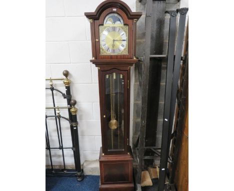 Modern Reproduction long case clock with silvered and brass dial, Westminster chimes with silent mode.  Glass door which reve