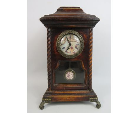 Reproduction quartz mantle clock which stands approx 36cm tall.