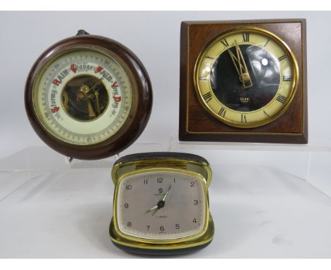 Vintage Oak cased enamel face barometer plus a vintage mantle clock and travel clock.