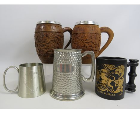 Selection of tankards made from Pewter, wood and ceramic.