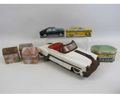 Vintage Tin Amar Toys friction car plus a selection of car and house related sweet tins.