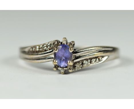 9ct white gold tanzanite &amp; diamond twist setting dress ring (2.8g)     2030353