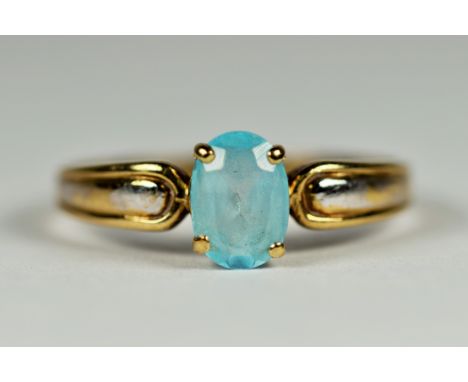 9ct Yellow gold ring set with 7 x 5mm Aqua. Finger size 'M-5'   1.4g