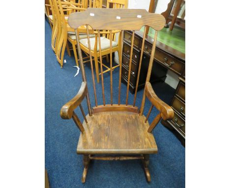 Lovely Stained pine stick back rocking chair in good condition. See photos.    S2