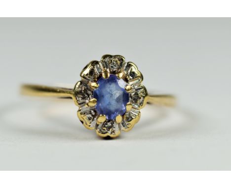 9ct white and yellow gold diamond and tanzanite oval illusion halo cluster dress ring (1.5g)     2041129