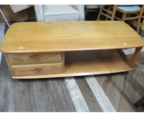 Ercol Style Blonde wood low table with shelf under and side drawers.   H:16 x W:49 x D:21 inches.  Runs smoothly on castors. 