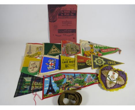 Mixed lot to include a Yorkshire Regiment Sweetheart cushion plus a selection of vintage Tourist pennants. A tuition book on 