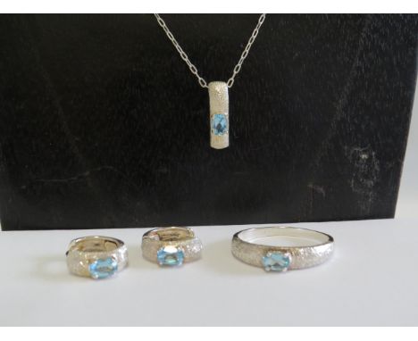 Sterling silver necklace &amp; pendant with matching earrings and ring set with blue stone.